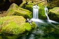 Discoverer boots and socks on mossy stone and relaxing