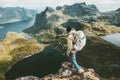 Discoverer man standing on cliff mountain in Norway