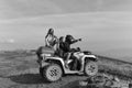 Discoverers. Man and girls ride quad Royalty Free Stock Photo