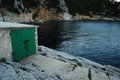 An old storage room for boats directly on the sea Royalty Free Stock Photo