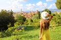 Discovering Florence. Back view of young tourist girl looking at Florence cityscape between trees. Tourism in Tuscany