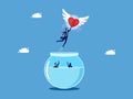 Discovering a new life. Businessman heart flying out of a fishbowl. business concept