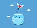 Discovering a new life. man heart flying out of a fishbowl. business concept