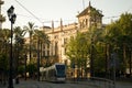 The tram slowly passes through the city center of Seville, Spain