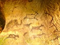 Discovery of prehistoric paint of caveman hunt in sandstone cave. Paint of human hunting