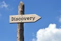 Discovery - wooden signpost with one arrow