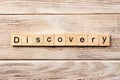 Discovery word written on wood block. discovery text on table, concept