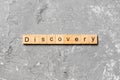 Discovery word written on wood block. discovery text on table, concept