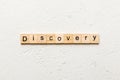 discovery word written on wood block. discovery text on table, concept