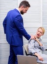 Discrimination abuse complaint. Victim sexual abuse at workplace. Abuse targeted at employee. Male coworker touching Royalty Free Stock Photo