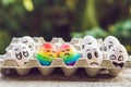 Discrimination gay concept. Two rainbow eggs in the form of a homosexual couple. And condemning people around