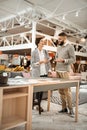 Curious concentrated couple inspecting colorful samples of table surface