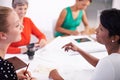 Discussing the plans. A group of female architects working together on a project at a conference table. Royalty Free Stock Photo