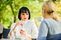 Discussing rumors. Trustful communication. Friendship sisters. Friendship meeting. Closest people. Girls friends drink Royalty Free Stock Photo