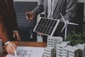 Discussion among businesspeople on the latest developments in solar cell panel technology and Solar Energy Environment city Royalty Free Stock Photo