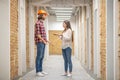 Female purchaser discussing construction issues with the worker Royalty Free Stock Photo
