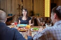 Discussion of three angry friends arguing in a coffee shop Royalty Free Stock Photo