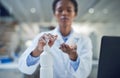 Disease stops today. a scientist disinfecting her hands while conducting research in a laboratory. Royalty Free Stock Photo