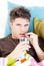 Diseased caucasian man taking pills with water Royalty Free Stock Photo