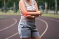 Diseases of the elbow joint, bone fracture and inflammation, tendon injury, athletic woman on a running track after workout Royalty Free Stock Photo