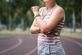 Diseases of the elbow joint, bone fracture and inflammation, tendon injury, skin abrasion, athletic woman on a running track after Royalty Free Stock Photo