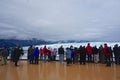 Disenchantment Bay, Alaska: Passengers on the bow of a cruise ship Royalty Free Stock Photo