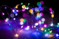 Disfocused blurred Christmas bokeh lights over dark background Royalty Free Stock Photo