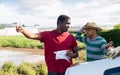 Disgruntled african american farmer reprimanding hispanic contractor