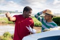 Disgruntled african american farmer reprimanding hispanic contractor