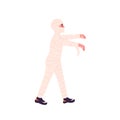 Disguised child walking in Halloween mummy costume. Boy dressed in carnival zombie clothes going. Kid wrapped in bandage