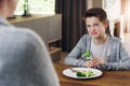 Disgust, vegetable and fear with child and broccoli for nutrition, health and cooking. Sad, angry and dinner with boy Royalty Free Stock Photo