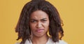 Disgusted african american woman feeling aversion, frowning face