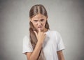 Disgusted, annoyed off teenager girl with finger in mouth gesture Royalty Free Stock Photo