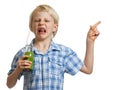 Disgusted boy with green smoothie pointing Royalty Free Stock Photo