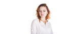 Disgusted and frowning young woman on a white background