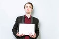 Disgusted, not happy young business man in red polo shirt and blazer holding blank A4 sheet of paper for slogan. Lose a job Royalty Free Stock Photo