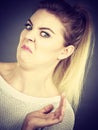 Disgusted woman having funny face expression Royalty Free Stock Photo