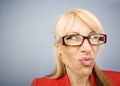 Disgusted woman in red making a funny face Royalty Free Stock Photo
