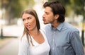 Disgusted Woman Rejecting To Kiss Man Walking Outdoors In Park