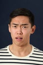 Disgusted young Asian man