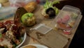 Disgusting dirty plates full of unhealthy food leftovers after student party