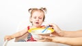 Disgusting kids nutrition. Cute baby crying, doesn`t want to eat meal