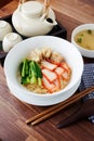 Asian barbecued pork egg noodle with wonton and a soup.