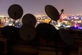 Dish Antennas and city lights in background