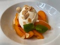 Dish of apricots with caramel mousse. Italian cuisine