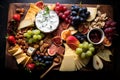 Dish of assorted cheeses, nuts, fruits, and dip on a black backdrop, AI-generated. Royalty Free Stock Photo