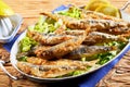 Dish of fried sardines, pilchards or anchovies Royalty Free Stock Photo