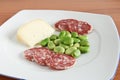 Dish with beans salami and cheese Royalty Free Stock Photo