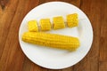 Dish with boiled corns on the wooden background Royalty Free Stock Photo