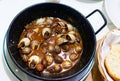 Dish of boiled snails closeup